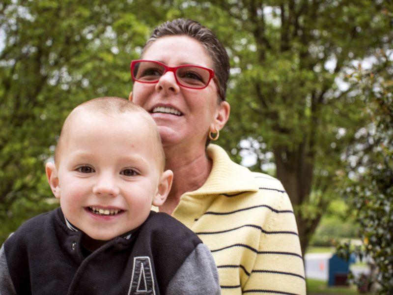 A Milton Hershey School grandmother parent/sponsor smiles with her grandson.